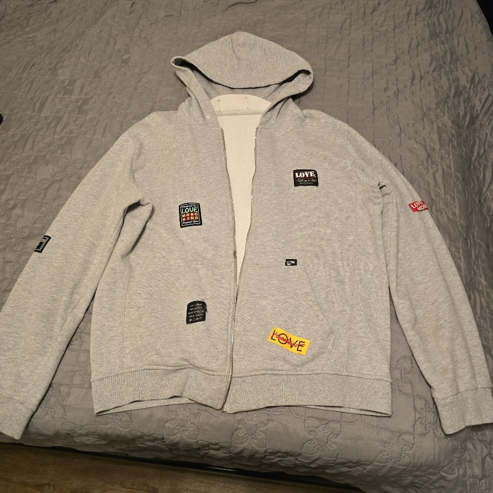 Moschino sweatshirt-heavy weight fabric.  1 small light yellow stain on the arm.